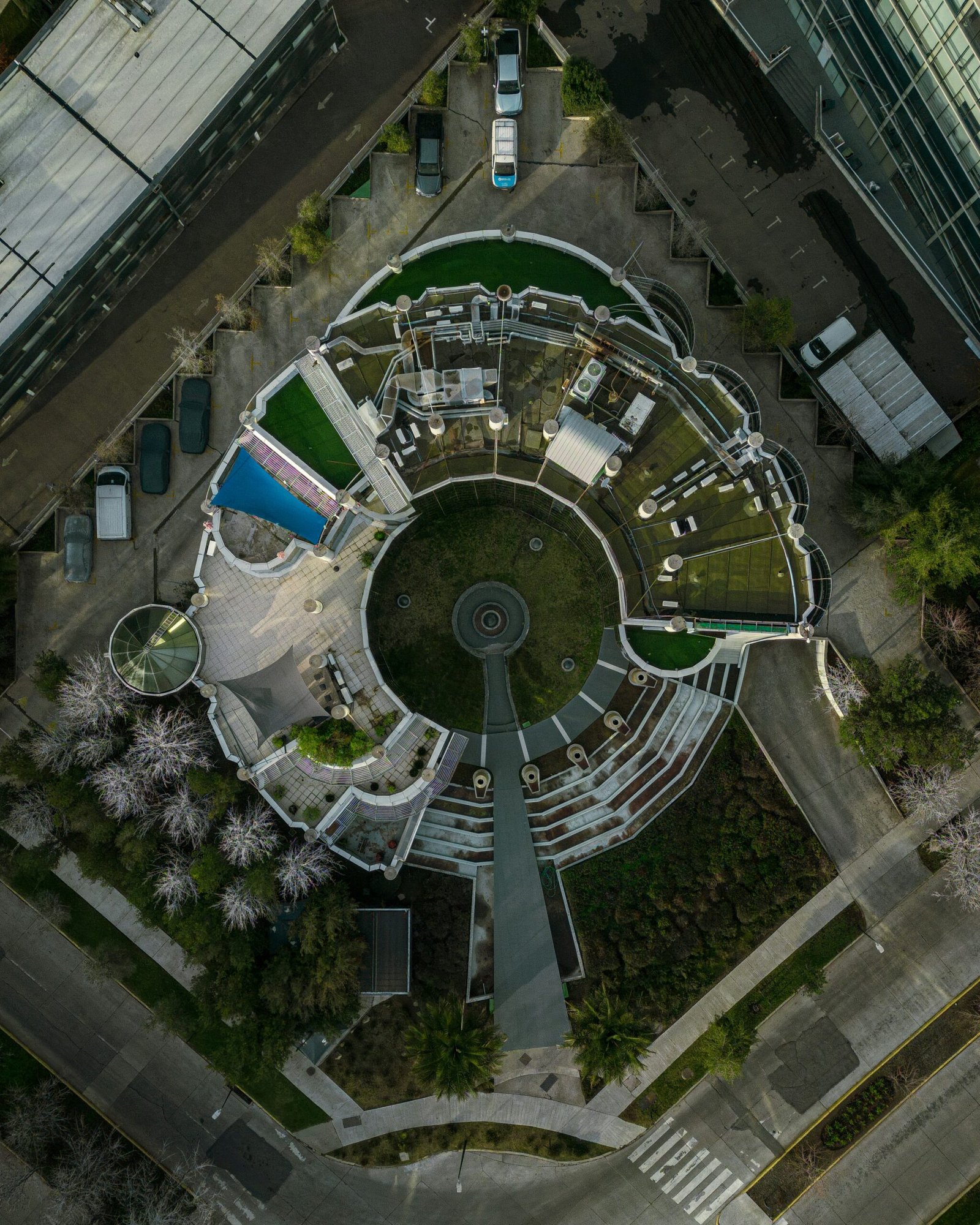 an aerial view of a circular building in a city